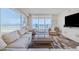 Spacious living room with ocean views and access to the balcony for outdoor seating at 4631 S Atlantic S Ave # 8201, Ponce Inlet, FL 32127
