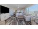 Living room featuring beautiful flooring and expansive windows with lovely ocean views at 4631 S Atlantic S Ave # 8201, Ponce Inlet, FL 32127