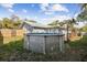 Backyard showcasing an above-ground pool, wooden deck, and surrounding greenery at 480 Columbus Ave, Orange City, FL 32763