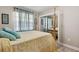 Comfortable bedroom showcases a wooden four poster bed and bright natural light at 480 Columbus Ave, Orange City, FL 32763