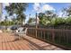 Outdoor deck with seating offering a relaxing backyard view and providing access to the home at 480 Columbus Ave, Orange City, FL 32763