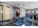 Well equipped home exercise room with weight machines, benches, and mirrored wall at 480 Columbus Ave, Orange City, FL 32763