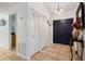 Bright foyer featuring tiled floor, coat closet, and a view of the entry door at 480 Columbus Ave, Orange City, FL 32763