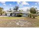 Charming single-story home with front lawn, stone details and an attached garage at 480 Columbus Ave, Orange City, FL 32763