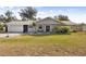 Charming single-story home with a well-manicured lawn and inviting front porch at 480 Columbus Ave, Orange City, FL 32763