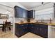 Well-appointed kitchen with wood counters, blue cabinets, and stainless steel appliances at 480 Columbus Ave, Orange City, FL 32763
