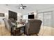 Inviting living room with fireplace, ceiling fan, and sliding glass doors for easy access to the outdoors at 480 Columbus Ave, Orange City, FL 32763