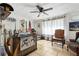 Bright sun room with natural light, western decor, rustic accents, and a decorative tin ceiling at 480 Columbus Ave, Orange City, FL 32763
