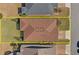 Aerial view of a house with brown roof shingles, surrounded by well-kept lawns and neighboring properties at 5065 Nw 35Th Pl, Ocala, FL 34482