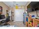 Bedroom featuring desk and chair area, plus double door closet and doorway entrance at 5065 Nw 35Th Pl, Ocala, FL 34482