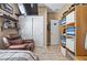 Bedroom features wood-look flooring, a recliner chair and a closet for optimal storage solutions at 5065 Nw 35Th Pl, Ocala, FL 34482