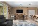 Dining area with a rustic wood table, seating for six, and a modern light fixture at 5065 Nw 35Th Pl, Ocala, FL 34482
