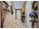 Stylish hallway featuring decorative elements, wood-look tile flooring, and neutral-toned walls at 5065 Nw 35Th Pl, Ocala, FL 34482