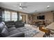 Comfortable living room area with plush seating, dining table, and natural light from sliding glass door at 5065 Nw 35Th Pl, Ocala, FL 34482