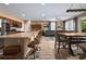 Bright and spacious living area showcasing an open layout with a kitchen island, dining space, and comfortable seating at 5065 Nw 35Th Pl, Ocala, FL 34482
