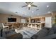 Open-concept living space with a modern kitchen, dining area, and comfortable seating at 5065 Nw 35Th Pl, Ocala, FL 34482
