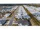 A captivating aerial view shows the neighborhood's layout including its serene lake and charming streetscapes at 562 Landshark Blvd, Daytona Beach, FL 32124