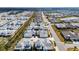 Expansive aerial view of a well-planned community with colorful homes and manicured streets at 562 Landshark Blvd, Daytona Beach, FL 32124