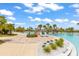 Turquoise lagoon style community pool features a bridge and lush tropical landscaping at 562 Landshark Blvd, Daytona Beach, FL 32124