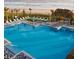 Relaxing community pool with ample seating, offering a perfect blend of luxury and leisure near the sandy beach at 562 Landshark Blvd, Daytona Beach, FL 32124