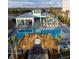 Elegant outdoor pool area with cabanas and seating, providing a luxurious retreat with resort-style amenities at 562 Landshark Blvd, Daytona Beach, FL 32124