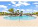 Large community pool with multiple seating areas and lush landscaping creating a resort-style atmosphere at 562 Landshark Blvd, Daytona Beach, FL 32124
