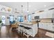 Open-concept kitchen with an island, granite countertops, stainless steel appliances, and seamless flow to the living area at 562 Landshark Blvd, Daytona Beach, FL 32124
