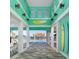 Inviting pool area showcasing turquoise accents, stylish architecture, and resort-style lounging at 562 Landshark Blvd, Daytona Beach, FL 32124