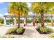 Outdoor lounge area with surfboard decor, comfortable seating, and lush landscaping for relaxing poolside at 562 Landshark Blvd, Daytona Beach, FL 32124