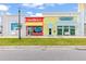 Quaint retail shops with vibrant facades offering a variety of services in a walkable area at 562 Landshark Blvd, Daytona Beach, FL 32124