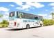 Community tour bus featuring tropical graphics offering convenient transportation for residents at 562 Landshark Blvd, Daytona Beach, FL 32124