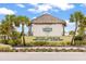 Latitude Town Square features a sign listing amenities, set amid lush landscaping with palm trees at 562 Landshark Blvd, Daytona Beach, FL 32124