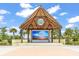 Community town square with a large screen, perfect for events and gatherings under a tiki-style roof at 562 Landshark Blvd, Daytona Beach, FL 32124