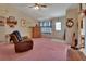 Comfortable living room with a ceiling fan and natural light creates a warm atmosphere at 5717 Us Highway 17, De Leon Springs, FL 32130