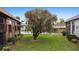 Backyard view featuring lawn, landscaping, and trees in a condo setting at 600 N Boundary Ave # 115D, Deland, FL 32720