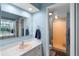 Bathroom with a large mirror, vanity sink, and shower with a frosted glass door at 600 N Boundary Ave # 115D, Deland, FL 32720