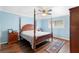 Bedroom featuring wood floors, a four poster bed, and a window at 600 N Boundary Ave # 115D, Deland, FL 32720