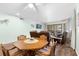 Dining area with light-colored walls, wood-look flooring, and a wooden table with seating for four at 600 N Boundary Ave # 115D, Deland, FL 32720