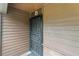 Apartment D entryway featuring a metal security gate at 600 N Boundary Ave # 115D, Deland, FL 32720