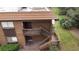 A close-up shot of a two-story condo with brown siding and an external staircase at 600 N Boundary Ave # 115D, Deland, FL 32720