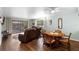 Living room featuring hardwood floors, a ceiling fan, and a sliding glass door to the patio at 600 N Boundary Ave # 115D, Deland, FL 32720