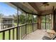 Screened porch with views of lush greenery and neighboring building at 600 N Boundary Ave # 115D, Deland, FL 32720