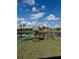 Backyard with play set overlooks water and a beautiful view, providing a serene outdoor experience at 7024 Lanier Falls Rd, Deland, FL 32724
