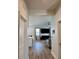Open floor plan showcasing the living room with wood floors and neutral decor at 7024 Lanier Falls Rd, Deland, FL 32724