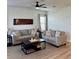 Cozy living room featuring comfortable sofas, a stylish coffee table, and neutral decor at 7024 Lanier Falls Rd, Deland, FL 32724