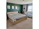A serene main bedroom features a large bed and a cozy crib at 7024 Lanier Falls Rd, Deland, FL 32724