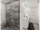 Modern bathroom featuring glass shower, neutral tones and updated vanity at 72 Aurora Ave, Ponce Inlet, FL 32127