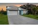Charming single-Gathering home with a two-car garage, lush lawn and beautiful Florida foliage at 72 Aurora Ave, Ponce Inlet, FL 32127