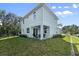Charming two-story home features a covered patio perfect for outdoor entertaining and relaxing at 72 Aurora Ave, Ponce Inlet, FL 32127