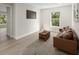 Bright living room with lots of light, modern fixtures, and wood flooring at 72 Aurora Ave, Ponce Inlet, FL 32127